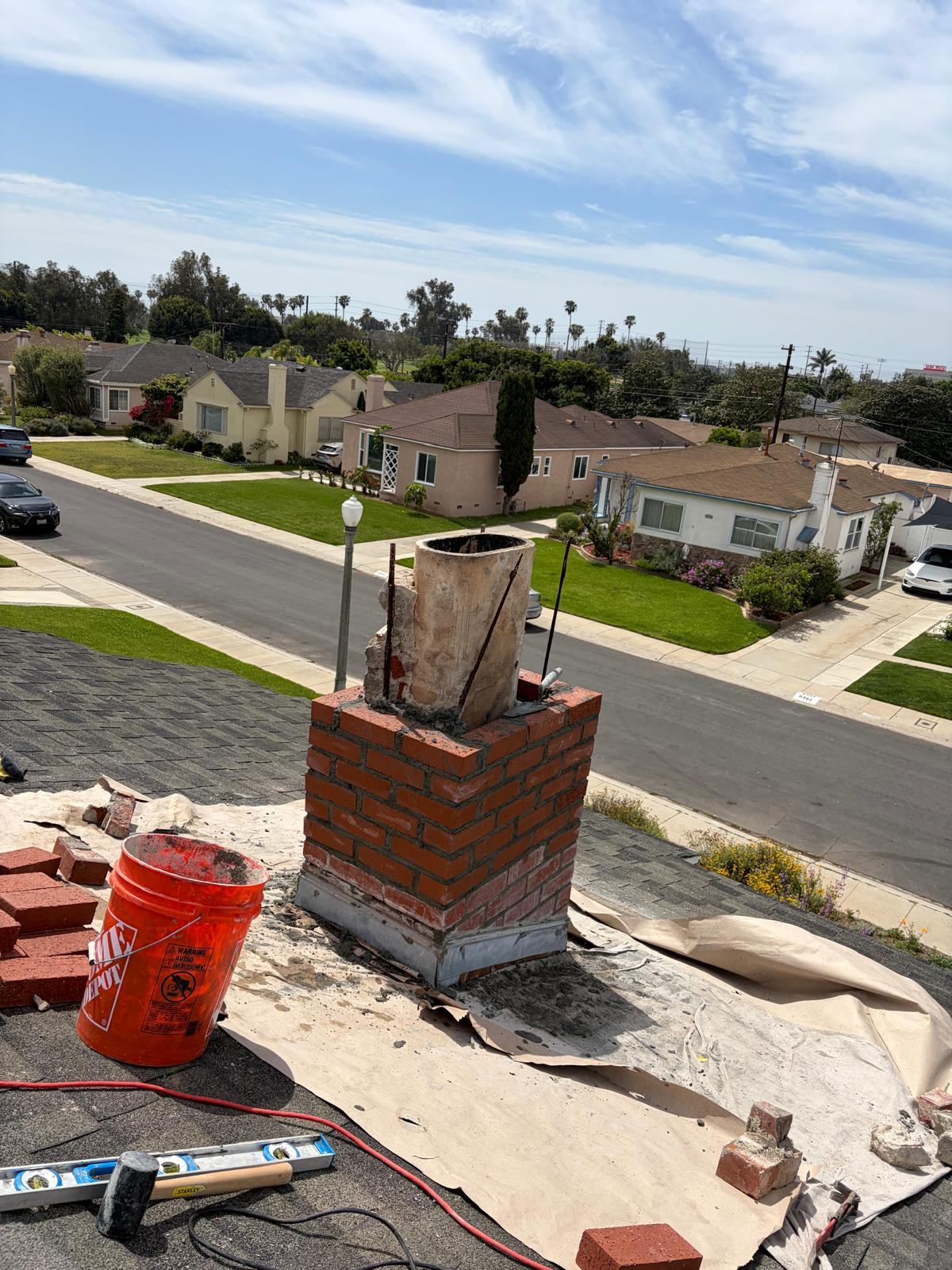 New brick courses being laid during chimney rebuild